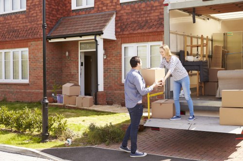 Professional packing team preparing boxes for a home move in Watford