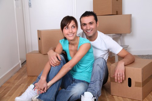 Boxes and furniture being prepared for transparent self storage pricing in Watford